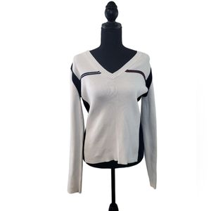 Classic Tommy Hilfiger size large, cream, red, and blue sweater